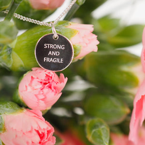 Strong and Fragile pendant